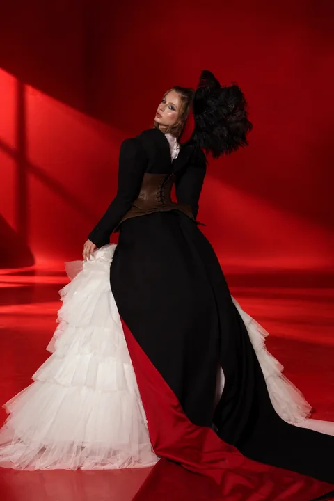 Karolina Juza — black gown with a white tulle skirt in a red studio