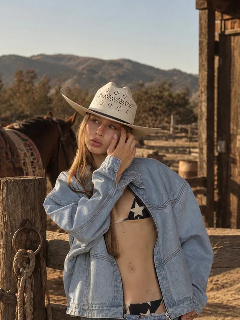 Karolina Juza — denim and a cowboy hat on a ranch