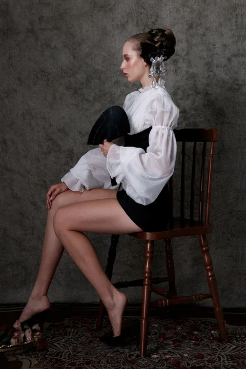 Karolina Juza — studio editorial on a painted backdrop