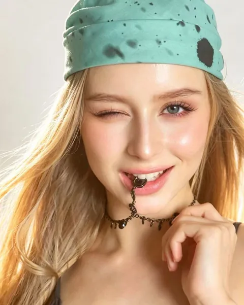 Karolina Juza — turquoise bandana by the sea