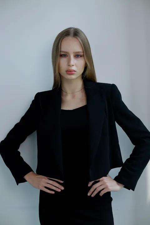Karolina Juza — clean looks against a pale wall