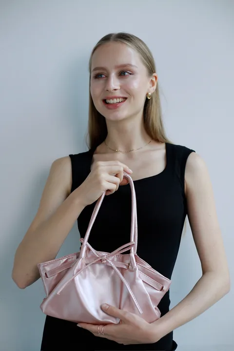 Karolina Juza — clean looks against a pale wall