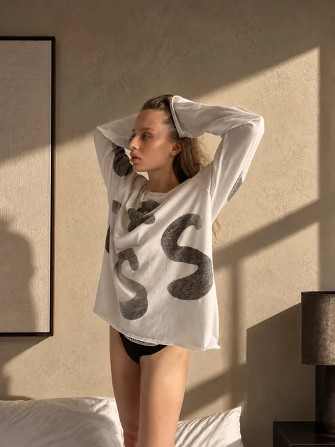 Karolina Juza — oversized knit sweater indoors