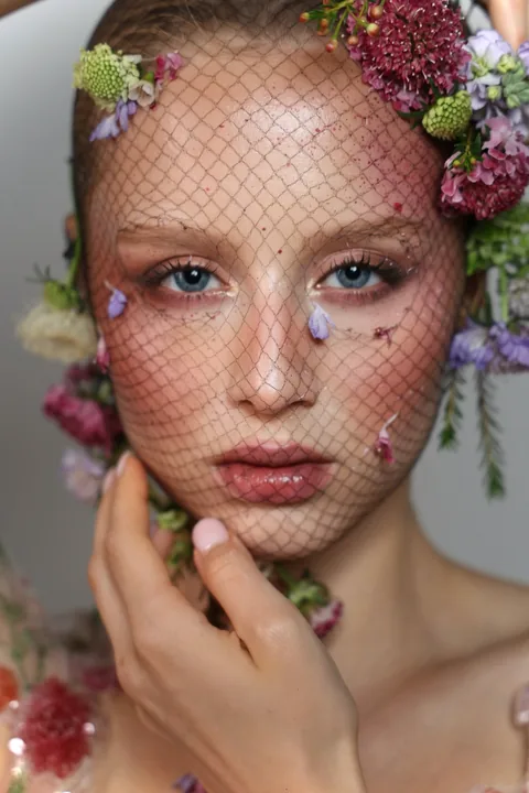 Karolina Juza — flowers and a net veil