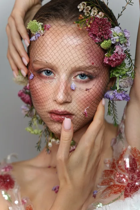 Karolina Juza — flowers and a net veil