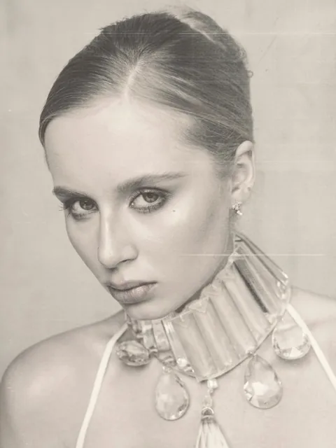 Karolina Juza — studio editorial on a painted backdrop