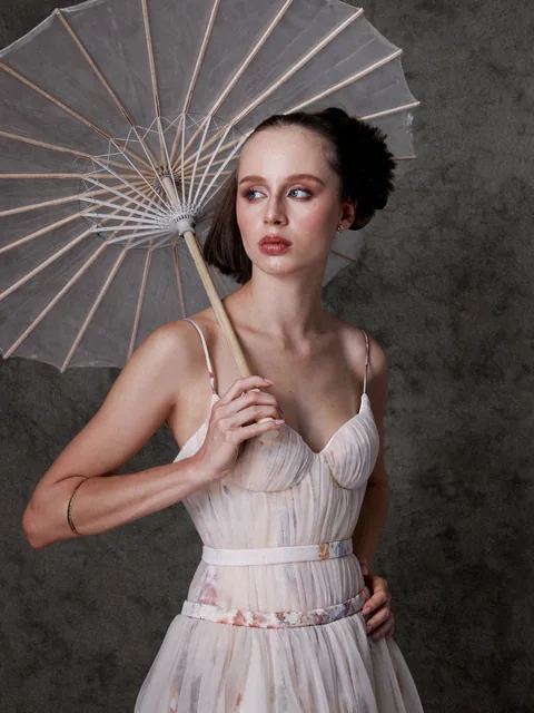 Karolina Juza — studio editorial on a painted backdrop